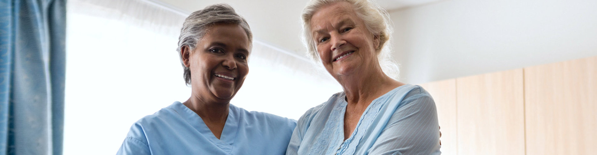 caregiver and her patient smiling